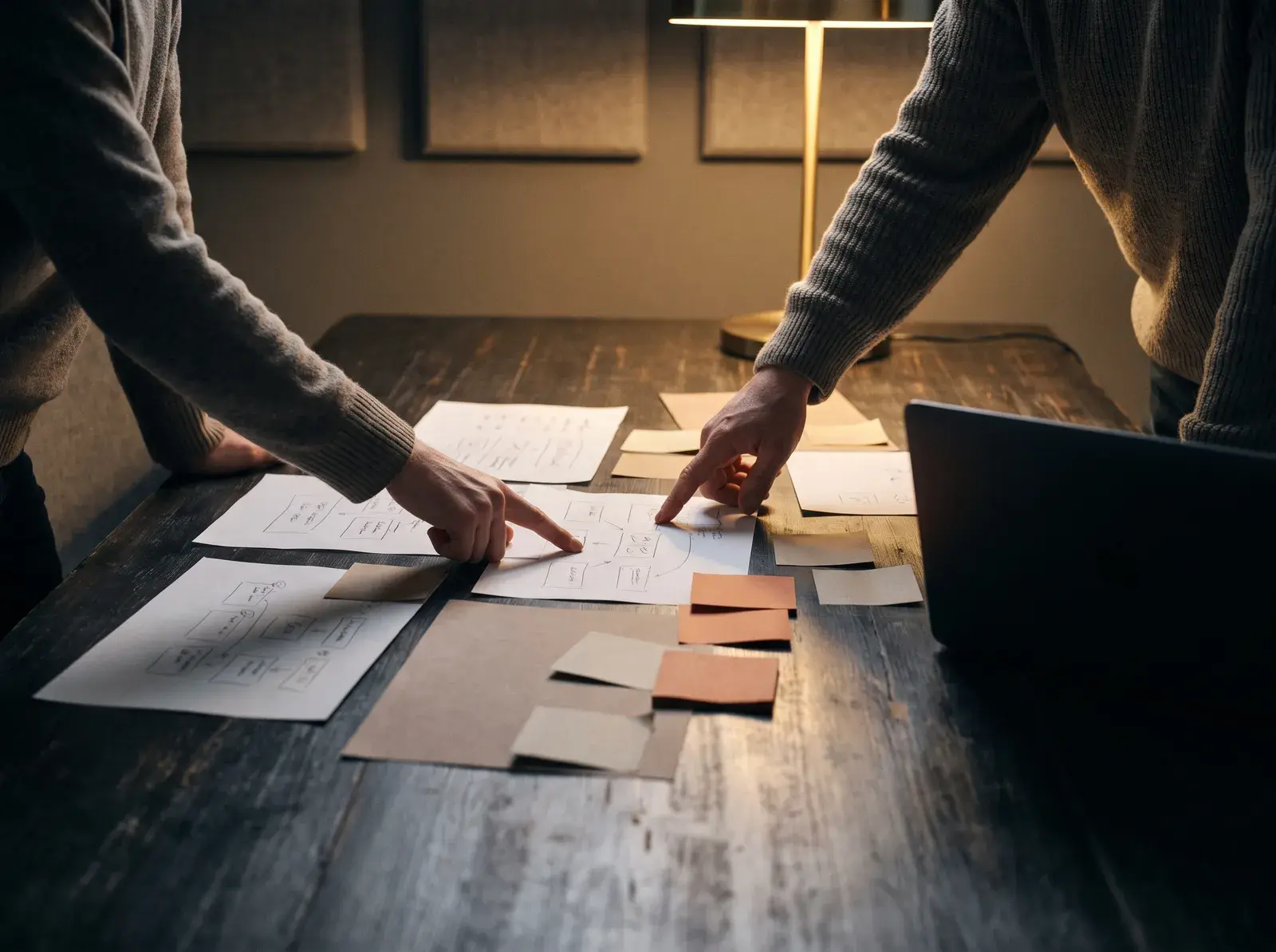 Strategy session with channel plans spread across a table